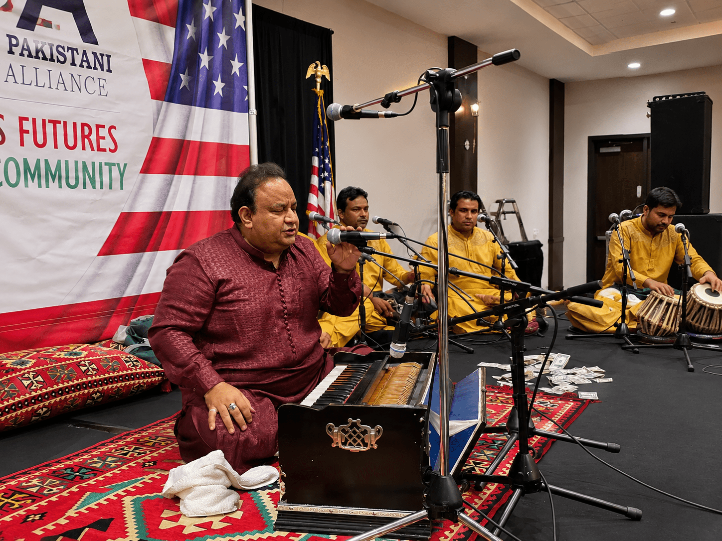Imran Aziz Mian performing Qawwali on stage at APCA event